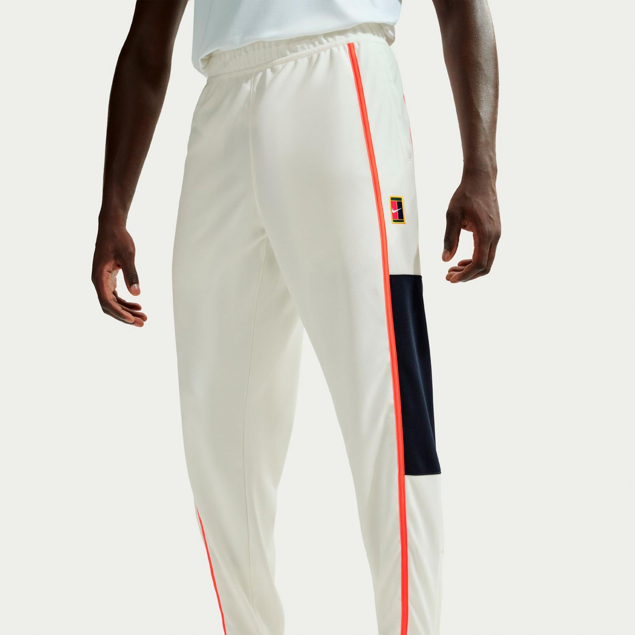 Nike Court Heritage Pantalón de entrenamiento Hombres-crema, naranja
